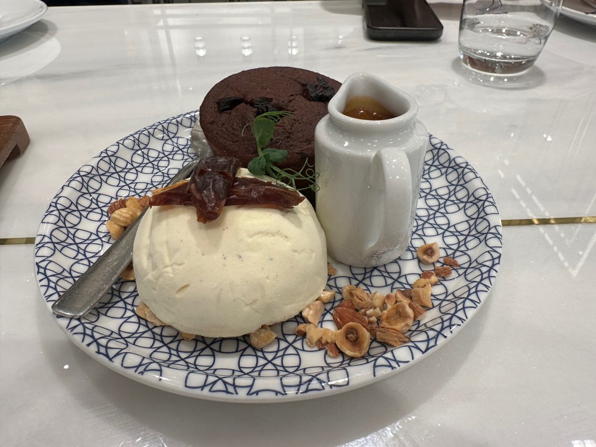 Date Pudding with vanilla ice cream, almond, hazelnut and caramel sauce&amp;nbsp;